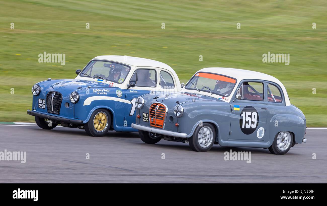 1955 & 1957 Austin A30 Academy racers of Jason Stanly and Charles Knill-Jones during the Sopwith Cup race at Goodwood 79MM, Sussex, UK. Stock Photo