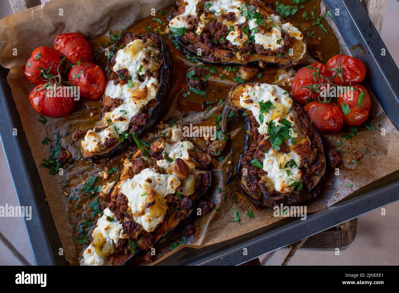 Stuffed aubergines with ground beef and feta cheese on a baking pan Stock Photo