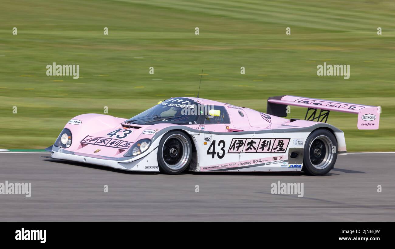 1989 Porsche 962C GTi Le Mans racer with driver Henry Pearman. 79th Goodwood Members meeting, Sussex, UK. Stock Photo
