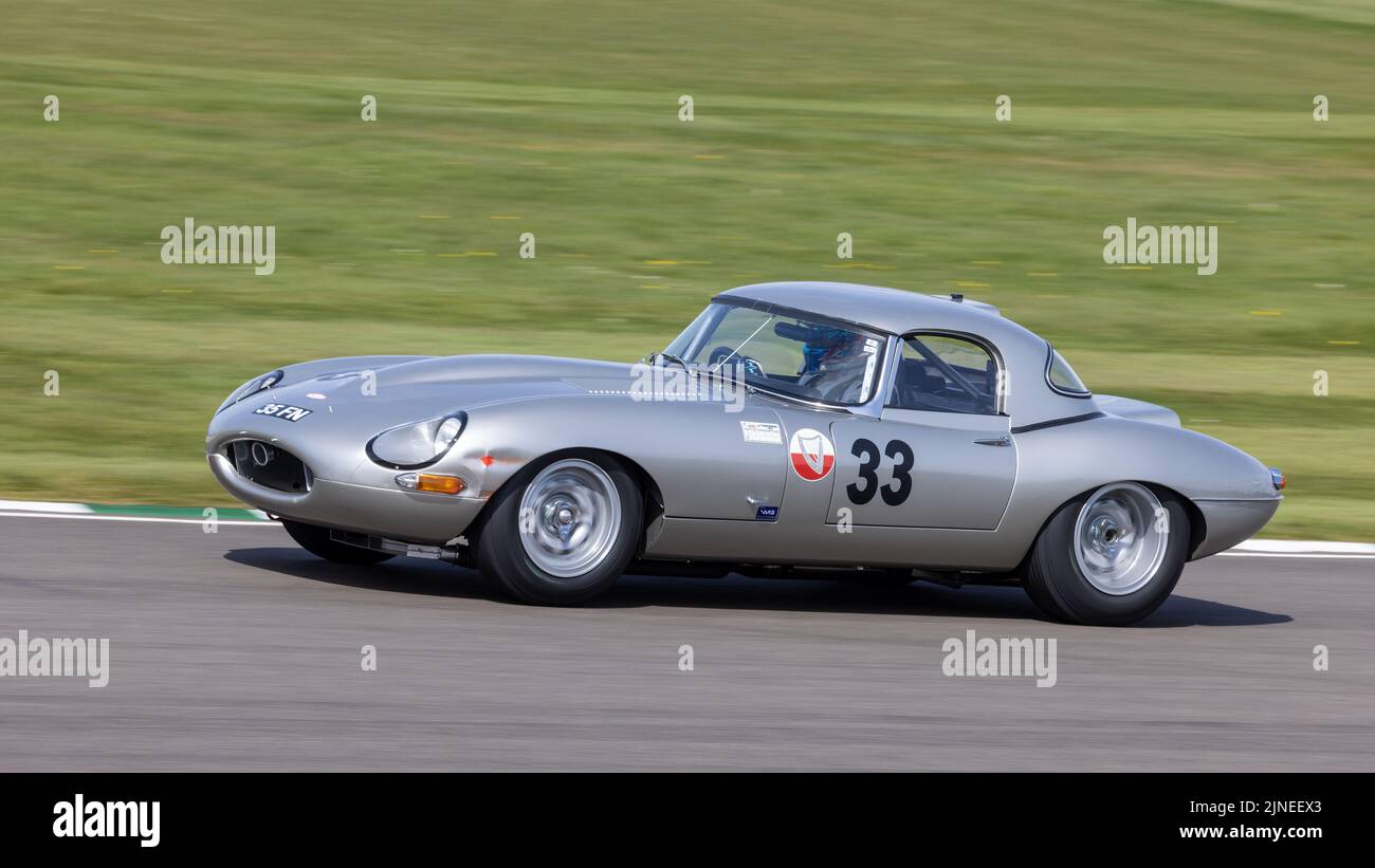 1963 Jaguiar E-Type Semi-Lightweight with driver Jon Minshaw during the Graham Hill Trophy race at the 79th Members Meeting, Goodwood, Sussex, UK. Stock Photo