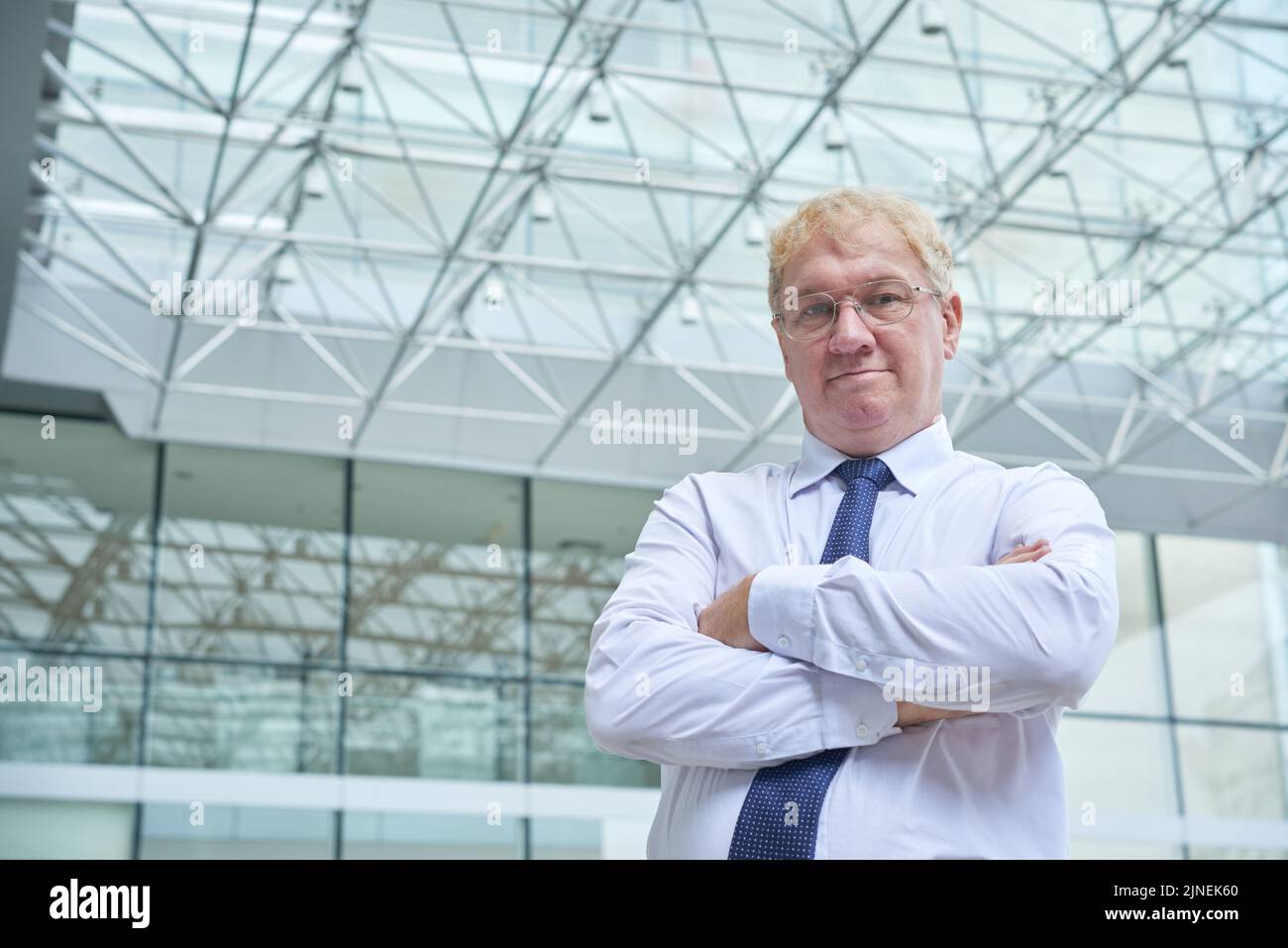 Portrait of confident middle-aged entrepreneur looking at camera Stock Photo