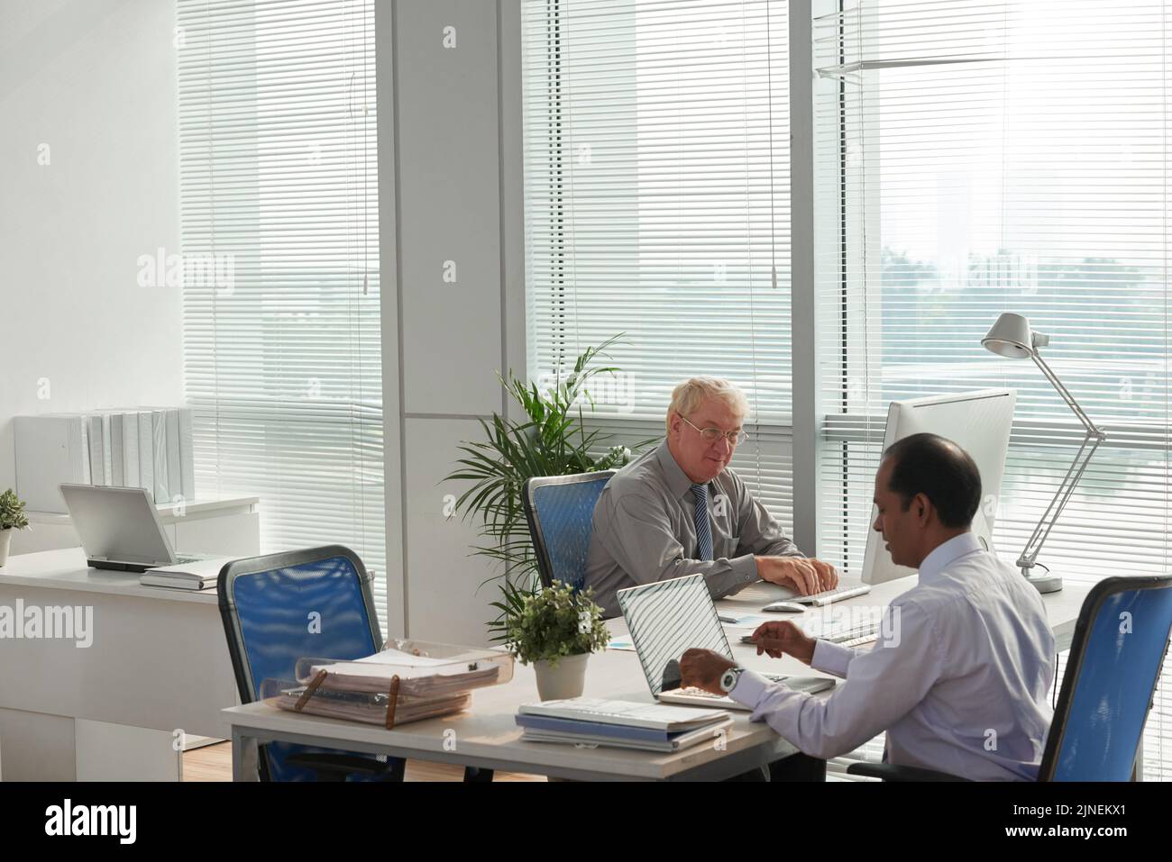 Professional financial managers working in modern office Stock Photo