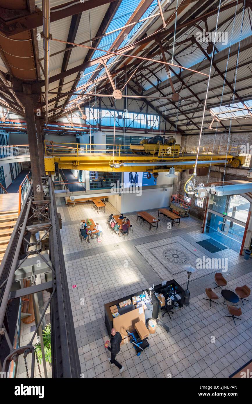 The interior of the National Innovation Centre situated in a converted locomotive workshop complete with gantry crane at South Eveleigh, Sydney, Aust. Stock Photo