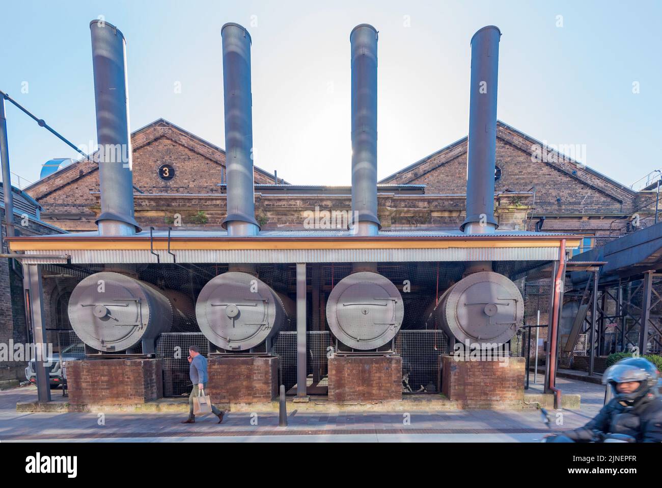 Disused but preserved old steam boilers, once part of the rail workshops now form part of the new technology office park at South Eveleigh in Sydney Stock Photo