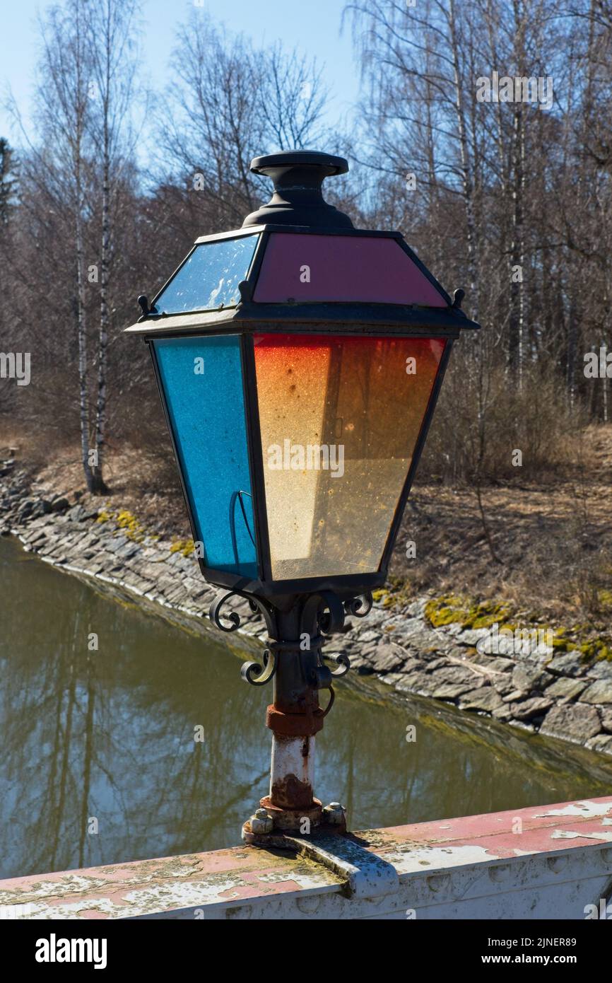 Old lamp on canal bridge handrail at Strömman kanava, Kemiönsaari, Finland. Stock Photo