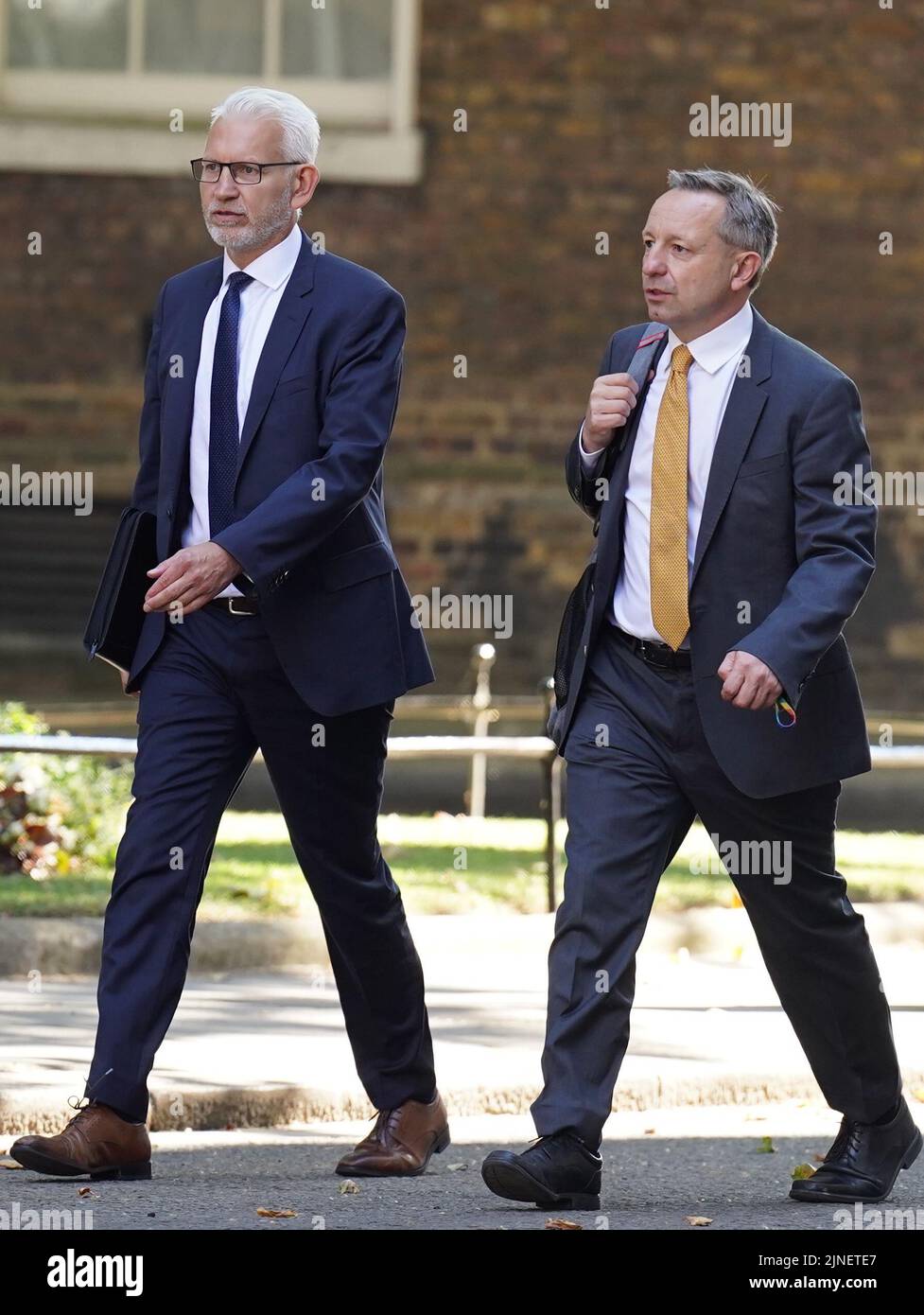 Michael Lewis, E.On chief executive (left), and Ofgem chief executive Jonathan Brearley (right) arriving in Downing Street London, ahead of a meeting between Downing Street and bosses from leading energy firms to discuss rising energy prices. Picture date: Thursday August 11, 2022. Stock Photo