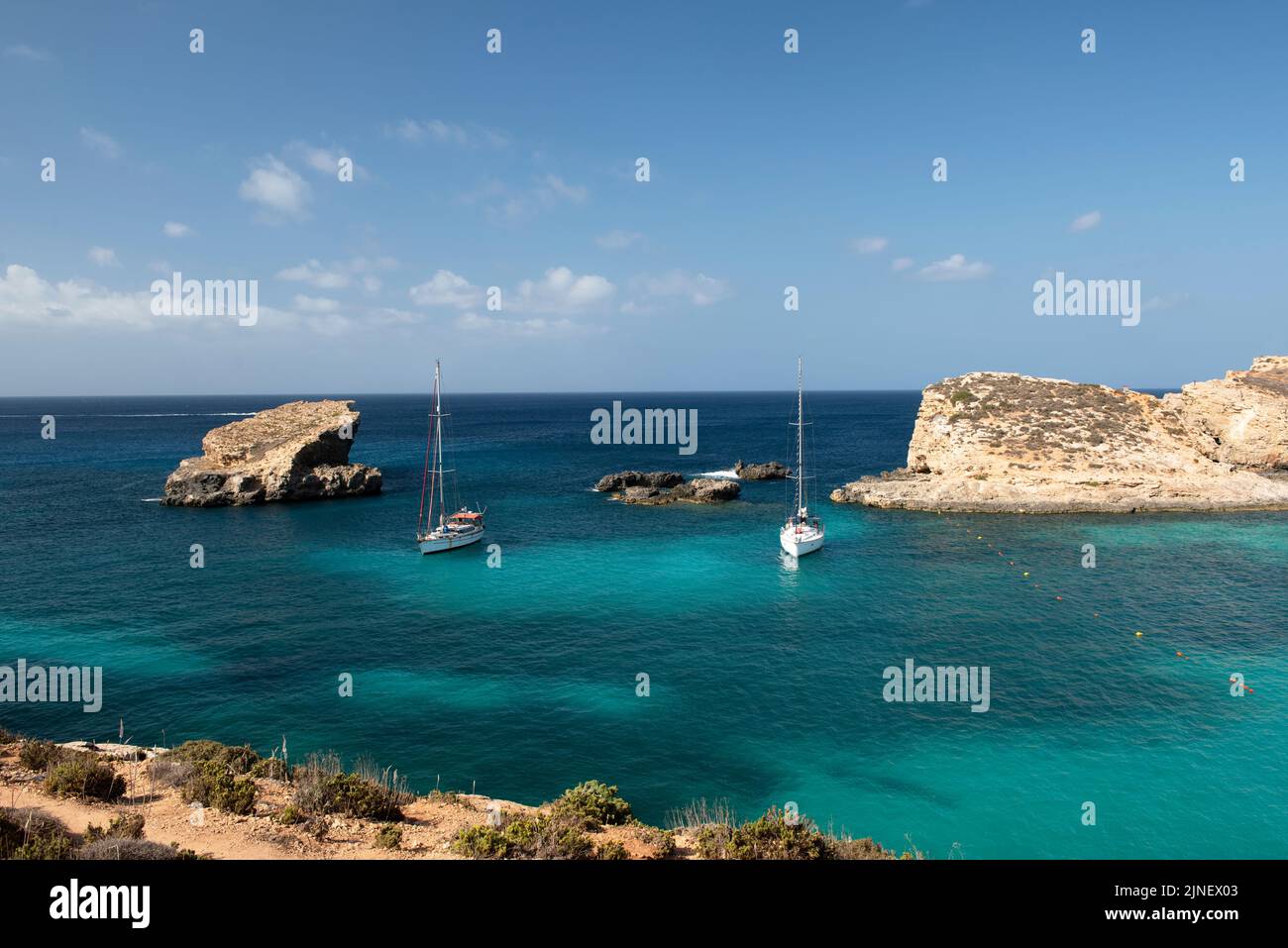 Beautiful scenic view of Comino island, Malta on nice sunny summer day. Turquise sea and rocky cost in Comino island, Malta Stock Photo