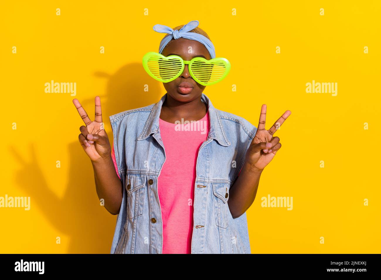 Portrait of funky person kiss lips hands fingers show vsign isolated