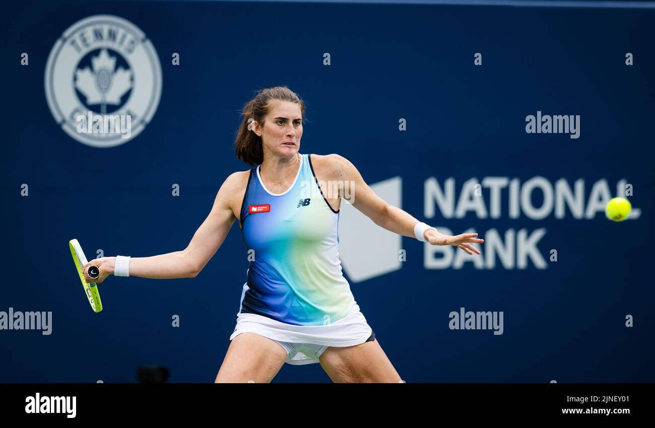 Rebecca Marino of Canada in action against Qinwen Zheng of China during