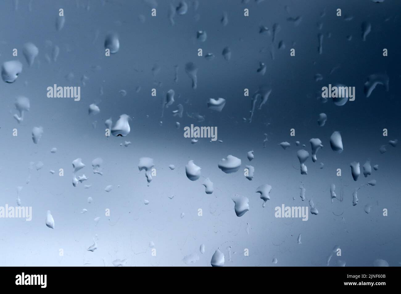 Water drops of rain on glass background Stock Photo - Alamy