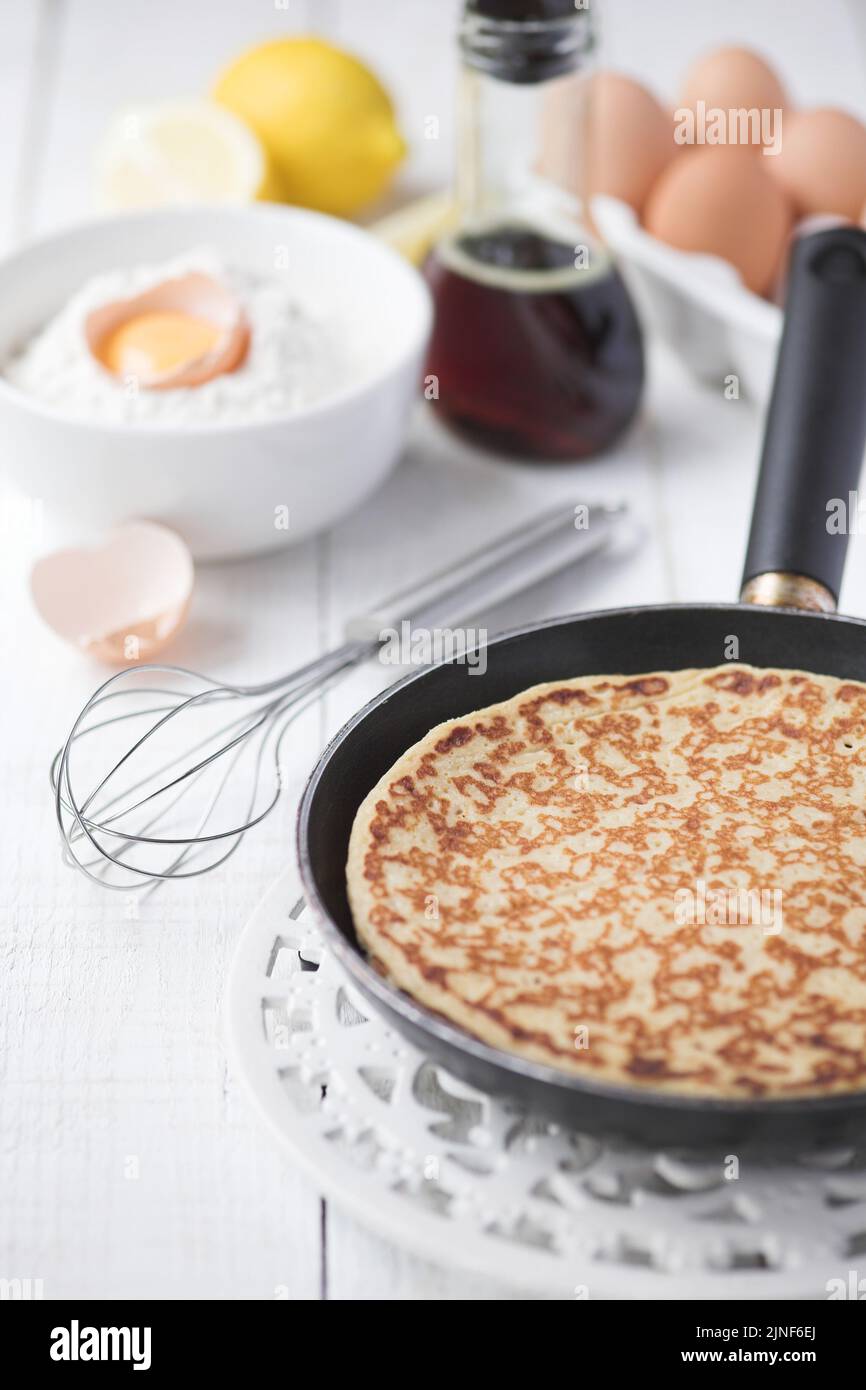 Freshly prepared crepes with maple syrup - shallow dof Stock Photo