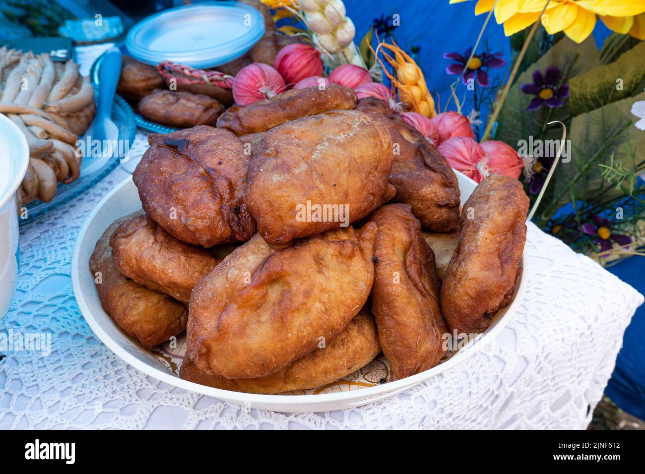 Homemade fried pies on a plate on the table. Stock Photo