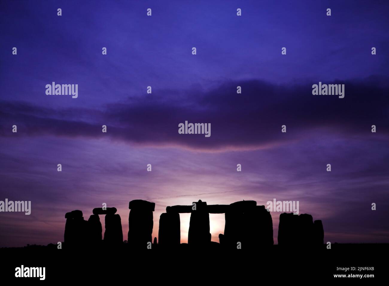 Stonehenge silhouetted at sun set Stock Photo