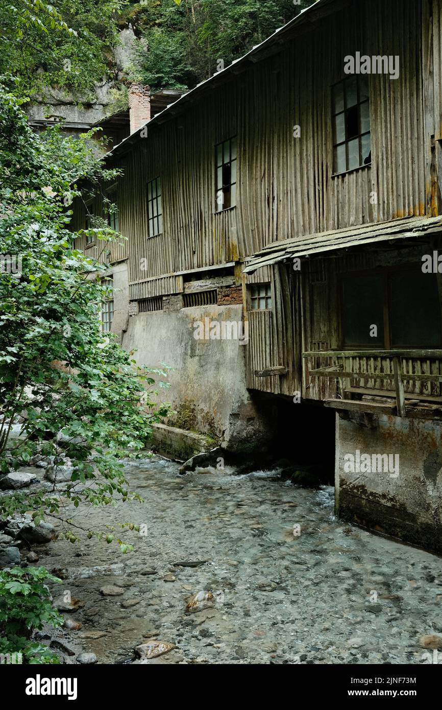 A vertical shot of an old sawmill building in the Seisenbergklamm gorge. Weissbach bei Lofer, Austria. Stock Photo