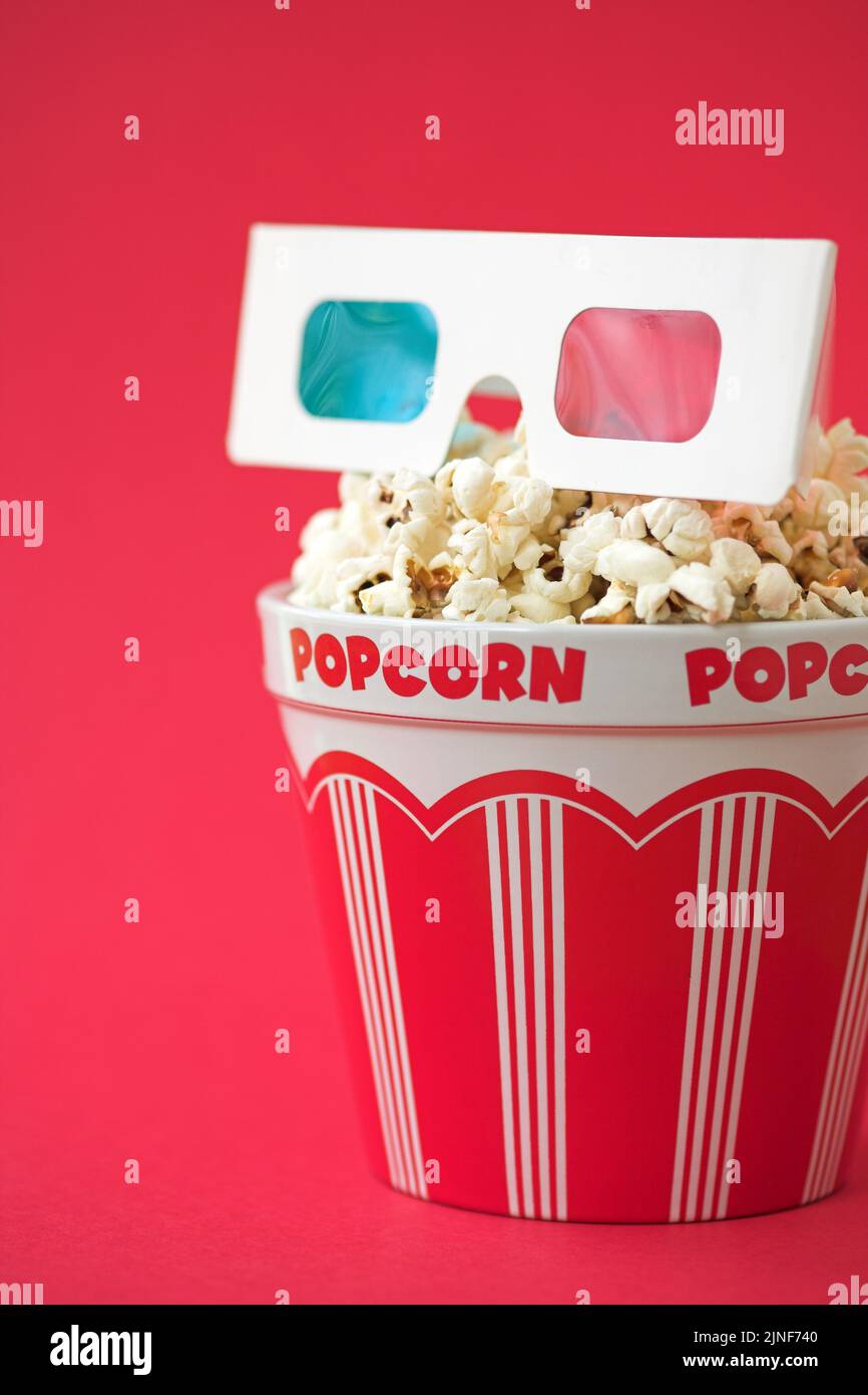 3D glasses & a bucket of popcorn - 3D cinema concept, shallow dof Stock Photo