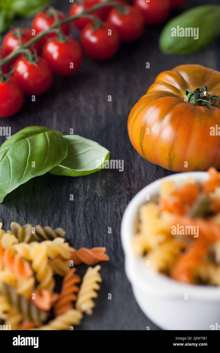 Pasta, tomato & basil - shallow dof Stock Photo