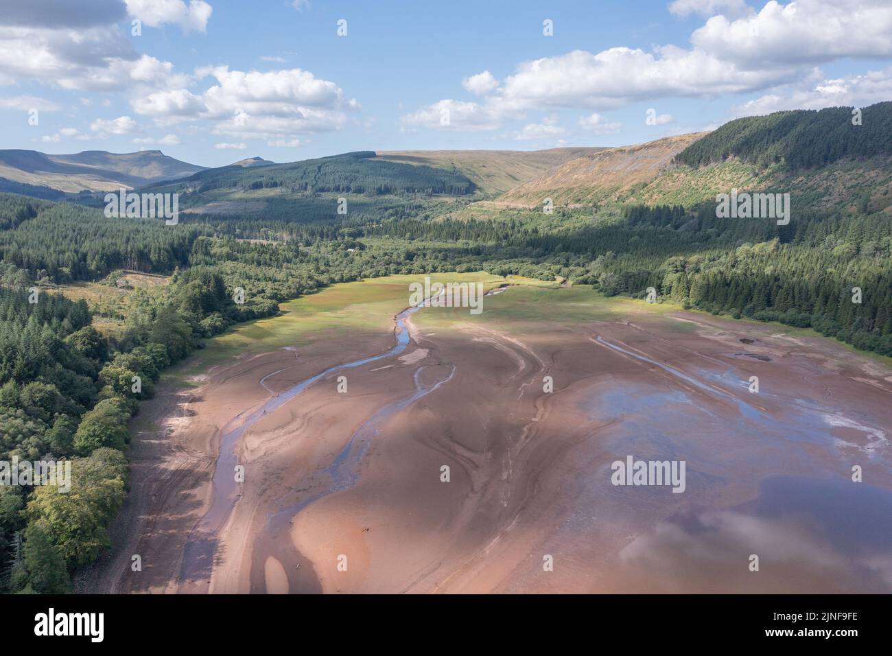 Aerial view of low water level in the Pentwyn Reservoir during the 8th August 2022 drought, Wales, UK Stock Photo