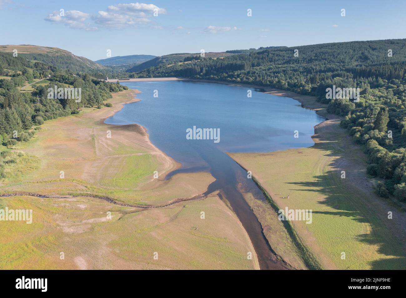 Aerial view of low water level in the Llwyn-onn Reservoir  during the 8th August 2022 drought, Wales, UK Stock Photo