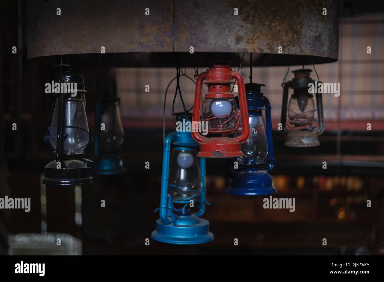 A candelabra of paraffin lamps repurposed for energy efficient