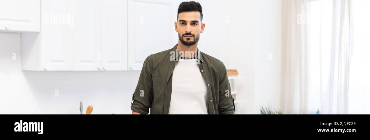 Young muslim man looking at camera at home, banner,stock image Stock Photo