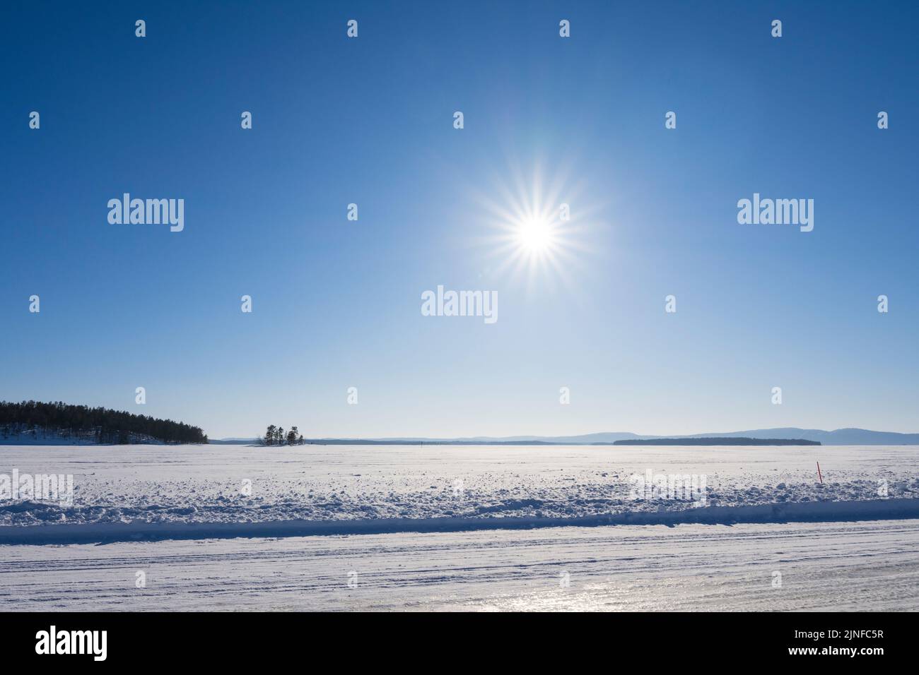 Ice road over Lake Pielinen in Eastern Finland. The longest official ice road in Europe’s inland waterways. Stock Photo