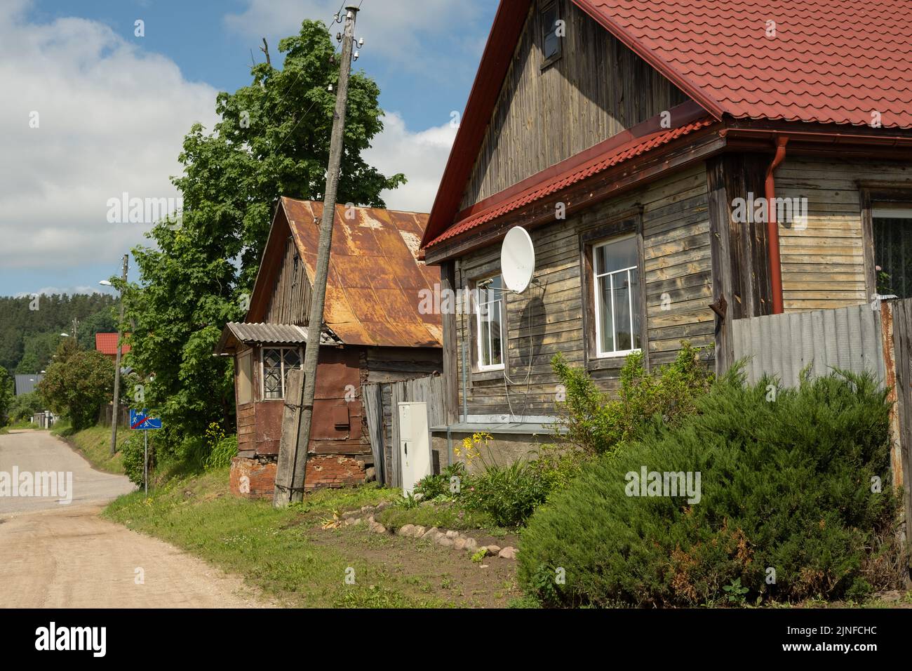 Old wooden living houses near riverside in Kraslava Stock Photo