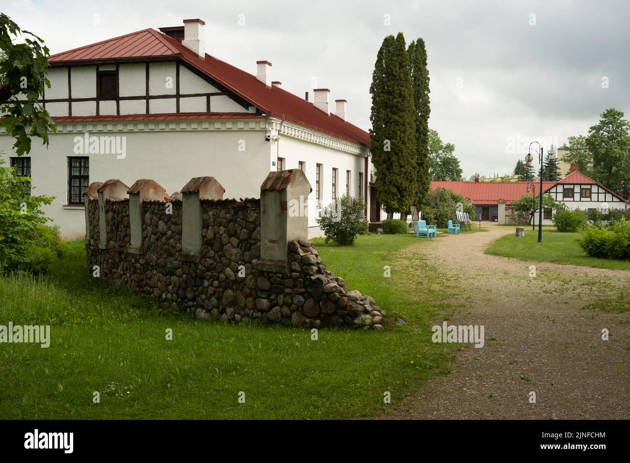 Ruined stone fence and old buildings near Kraslava palace Stock Photo