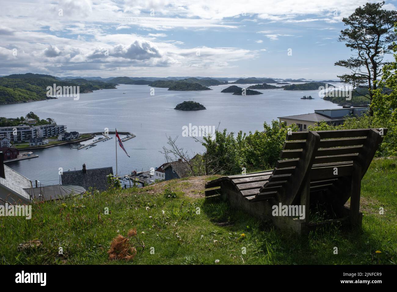 Farsund, Norway - May 30, 2022: Panoramic view of the city and many islands from a hill in a sunny spring day. A spectacular view to Lyngdalsfjorden Stock Photo