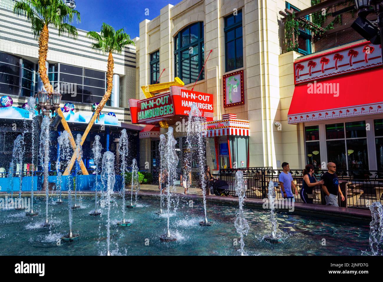 Enjoy a dazzling display at The LINQ Promenade fountain in front of In-N-Out Burger. A must-see Las Vegas attraction. Visit today Stock Photo