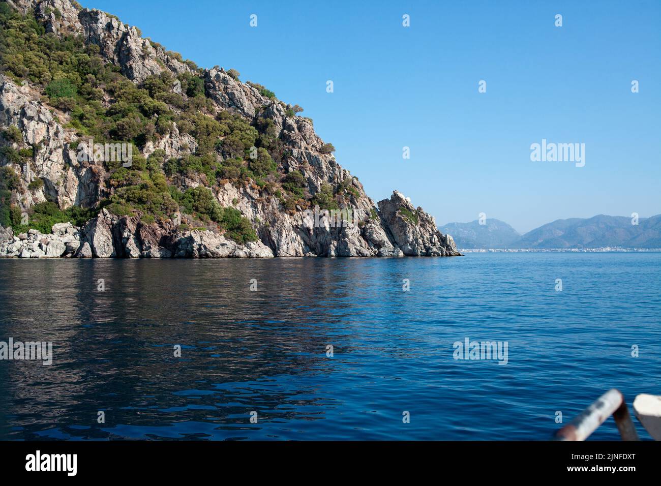 Mediterrenan Rocks Mediterranean rocky shores with green trees and landscape. View from ...