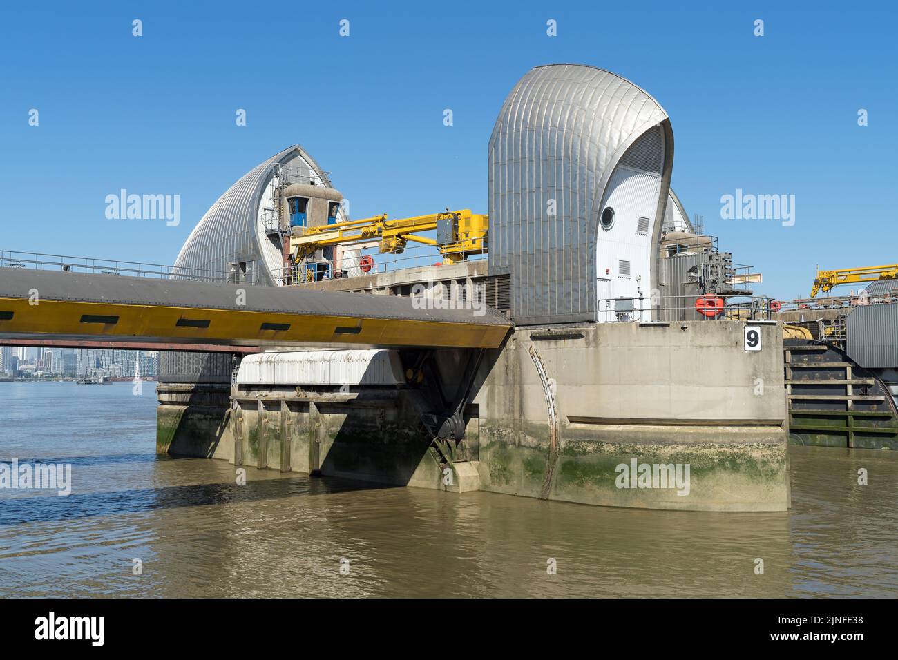 The Thames Barrier, London's flood defence system on a clear sunny day at high tide. Stock Photo
