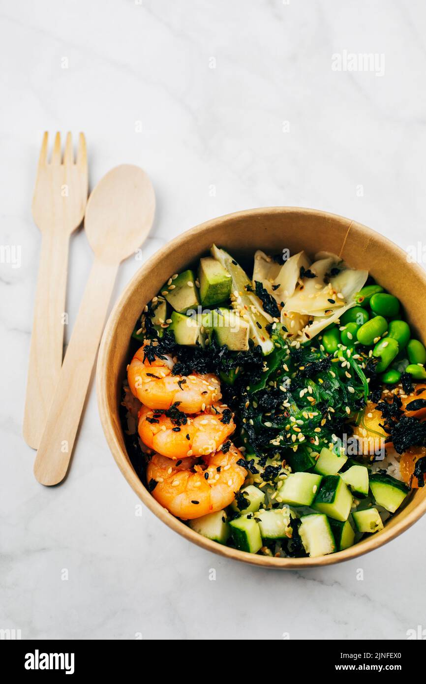 Poke bowl with shrimp, rice, chukka salad, edamame beans, cucumber and