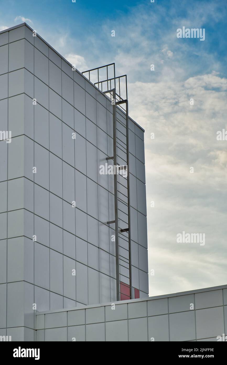 Fire escape ladder to the roof of modern building made of metal