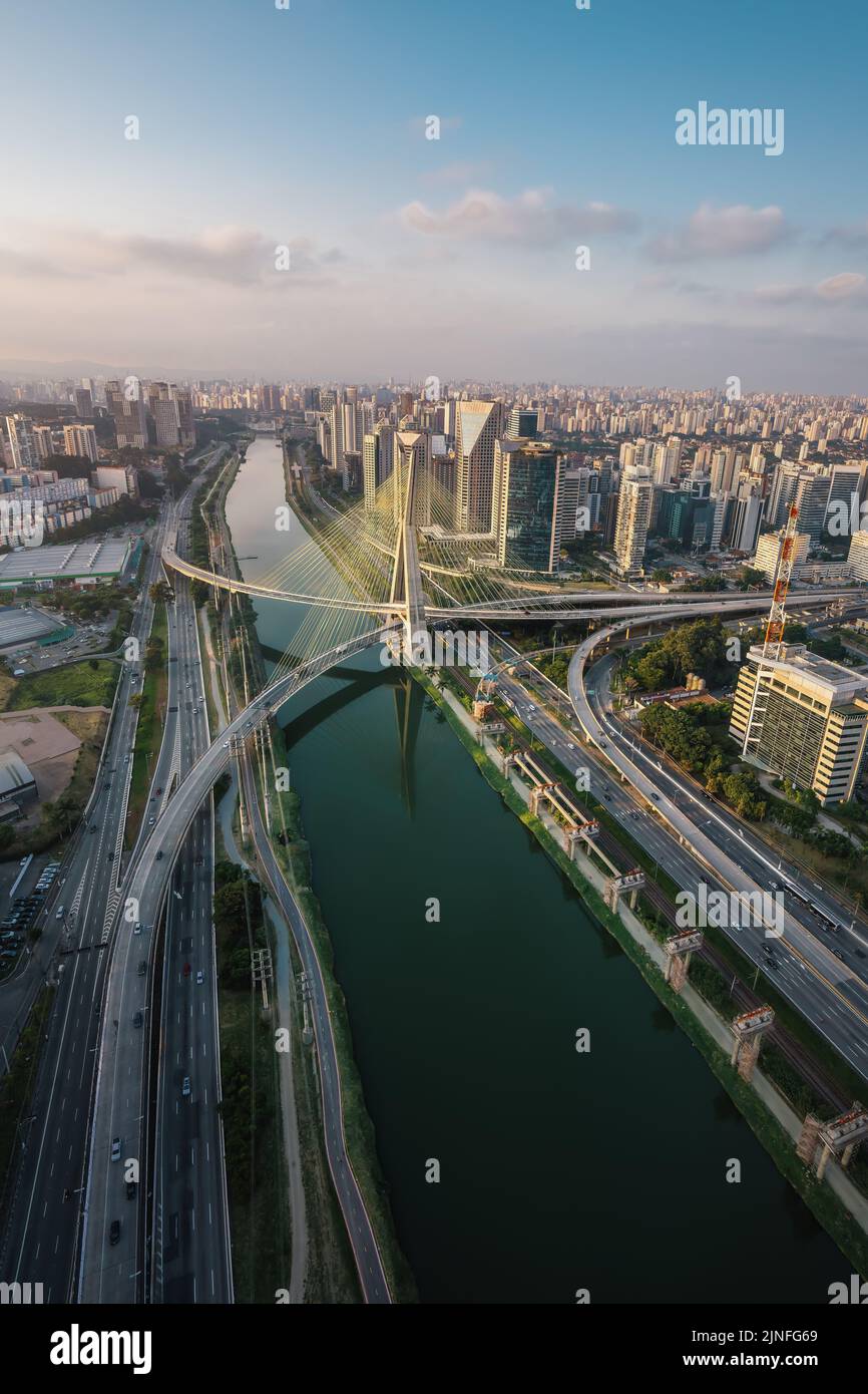 Aerial view of Octavio Frias de Oliveira Bridge (Ponte Estaiada) over Pinheiros River at sunset - Sao Paulo, Brazil Stock Photo