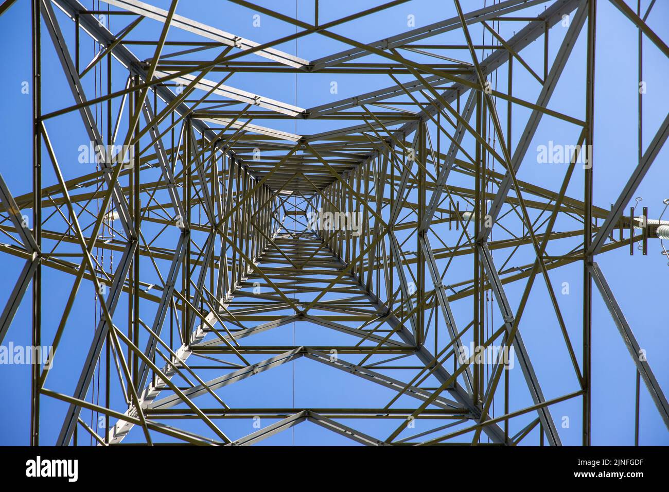 Generic picture dated August 10th shows electricity pylons in Cambridgeshire as the power crisis goes on with almost a quarter of households already owing £206 with further price increases in the autumn. Stock Photo