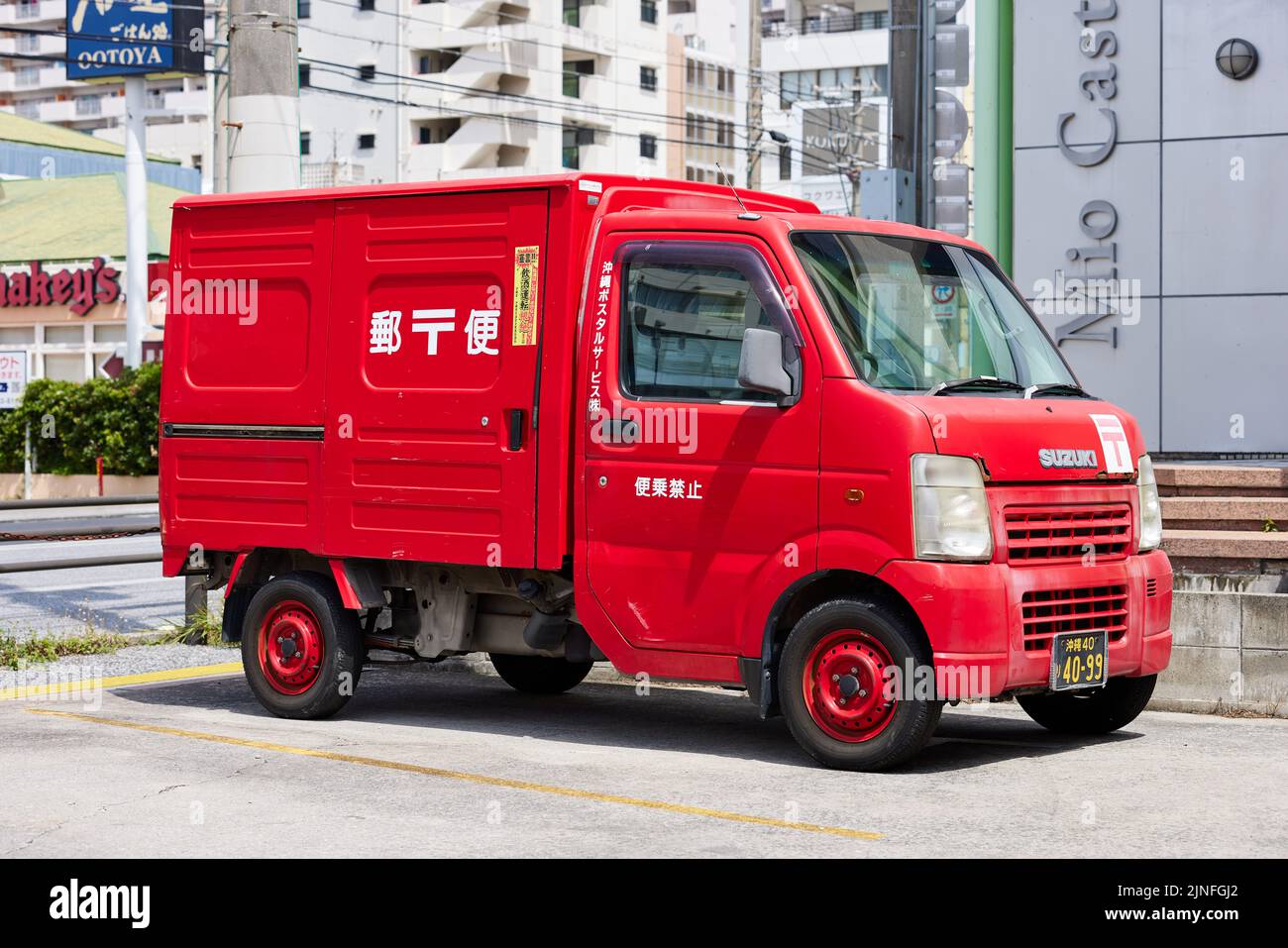 Japan Post car, red Suzuki; Naha, Okinawa Prefecture, Japan Stock Photo