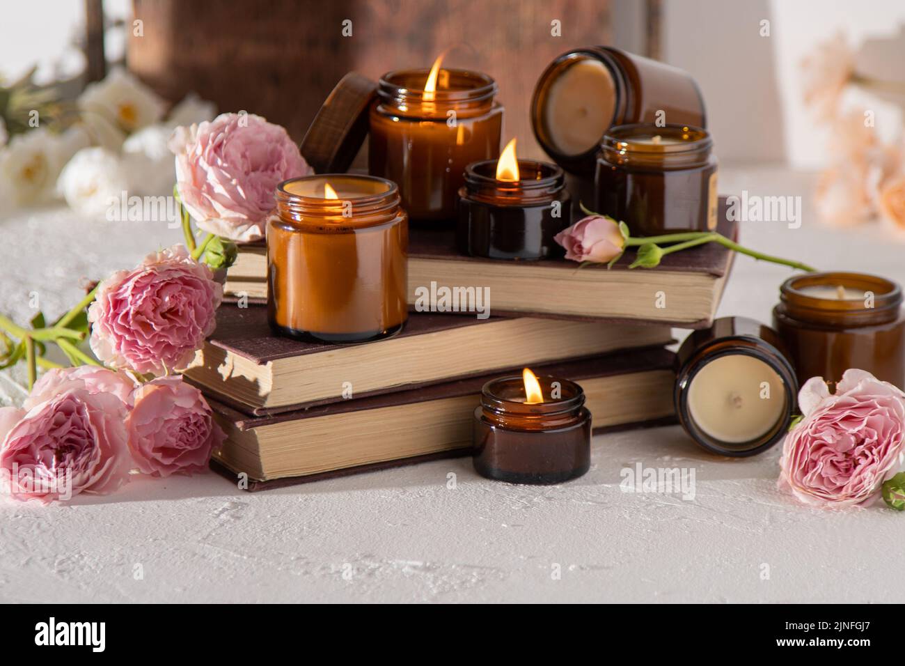 A set of different aroma candles in brown glass jars. Scented handmade ...