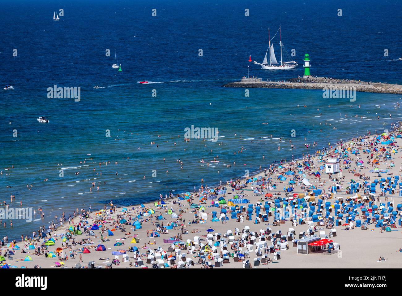 Rostock, Germany. 11th Aug, 2022. Tourists and day visitors take