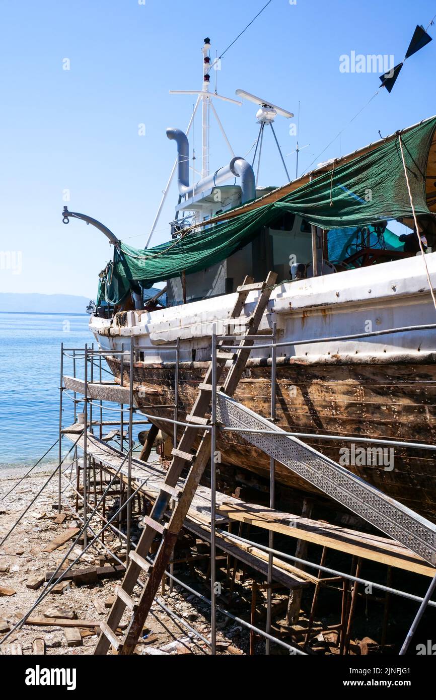 Boats waiting for refit in Kalafatia, old traditional shipyard of Kavala, Macedonia, North-Eastern Greece Stock Photo