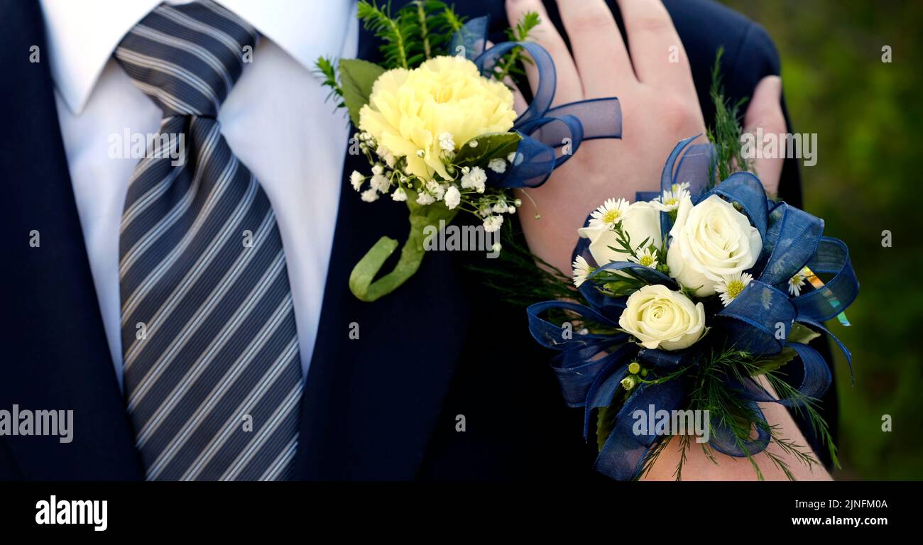 Hands of date Prom night flowers corsage formal wear Stock Photo
