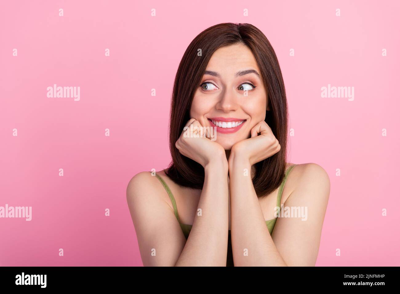 Photo Of Cute Brunette Lady Look Empty Space Wear Khaki Top Isolated On Pink Color Background 8594