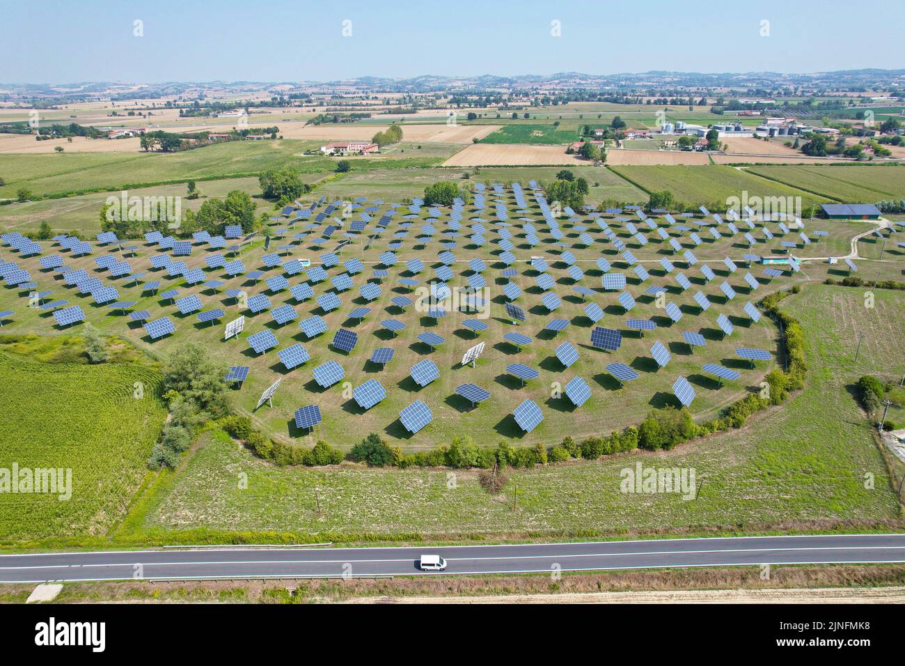 Silicon photovoltaic panels with defective single-axis tilted track system In a small solar power plant. Alessandria, Italy - August 2022 Stock Photo
