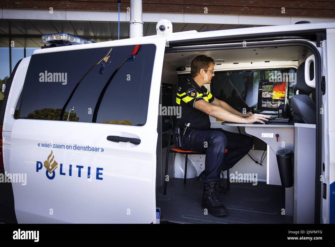 2022-08-11 14:04:59 DORDRECHT - A police officer in a video vehicle with  which the police in Dordrecht will test run for a year. By means of, among  other things, a rotating camera