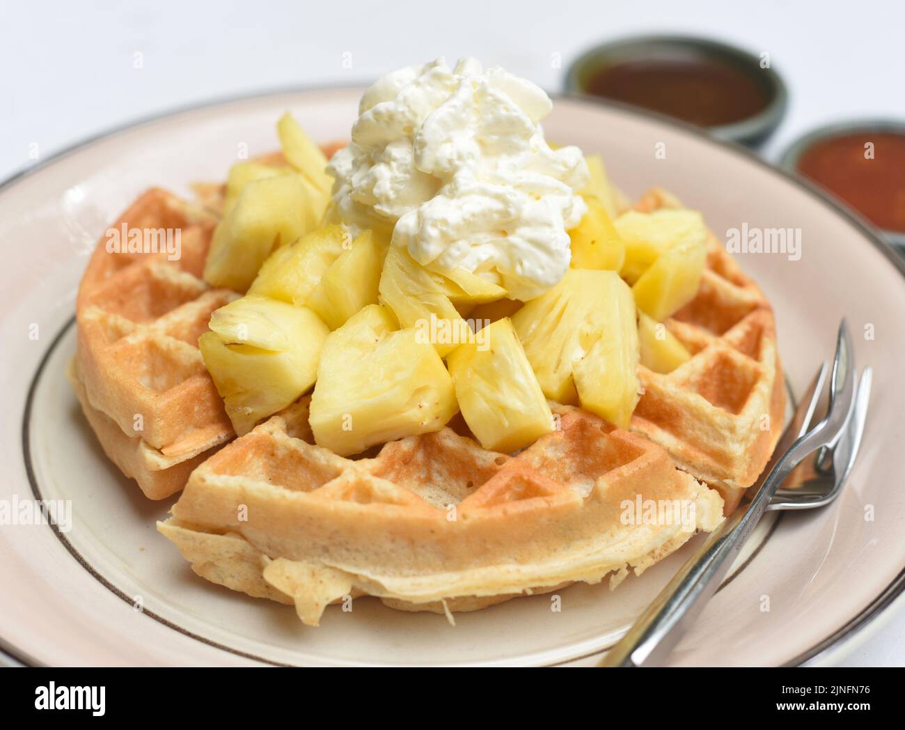 Belgium waffles with pineapple and ice ream on a plate Stock Photo