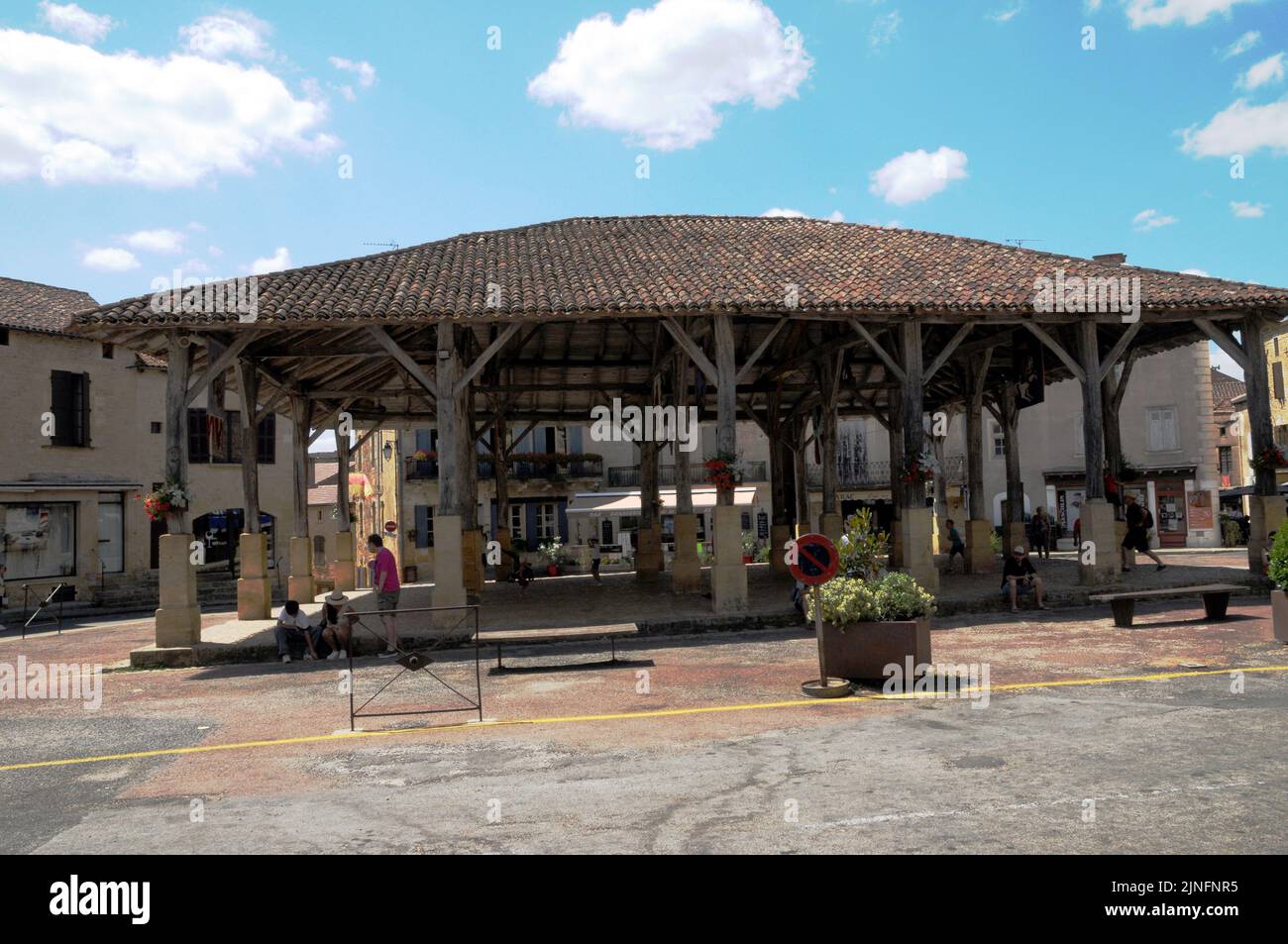The market square in the Perigord Noir village of Belvès. Markets are held every Saturday. Unusually there are old dwellings beneath the market. Stock Photo