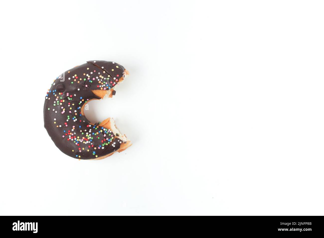 half eaten chocolate donuts on white background  Stock Photo