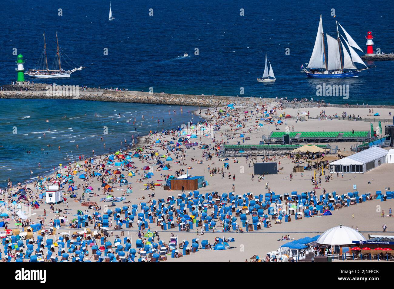 Rostock, Germany. 11th Aug, 2022. Tourists and day visitors take