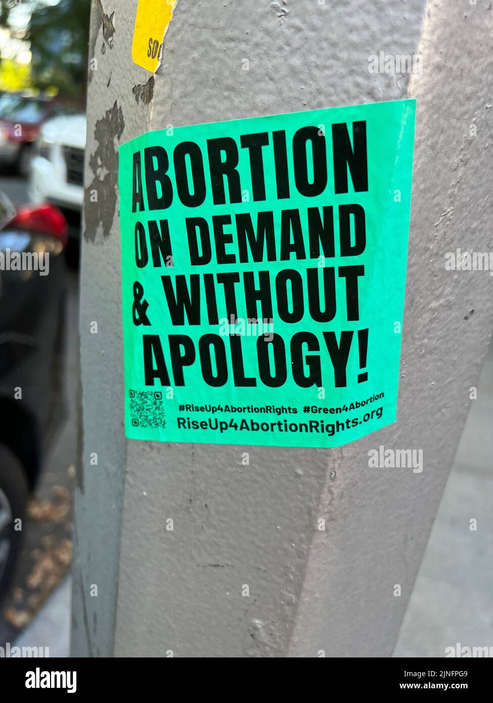 Pro-choice, Abortion on Demand sticker on a light post in a residential neighborhood in Brooklyn, New York. Stock Photo