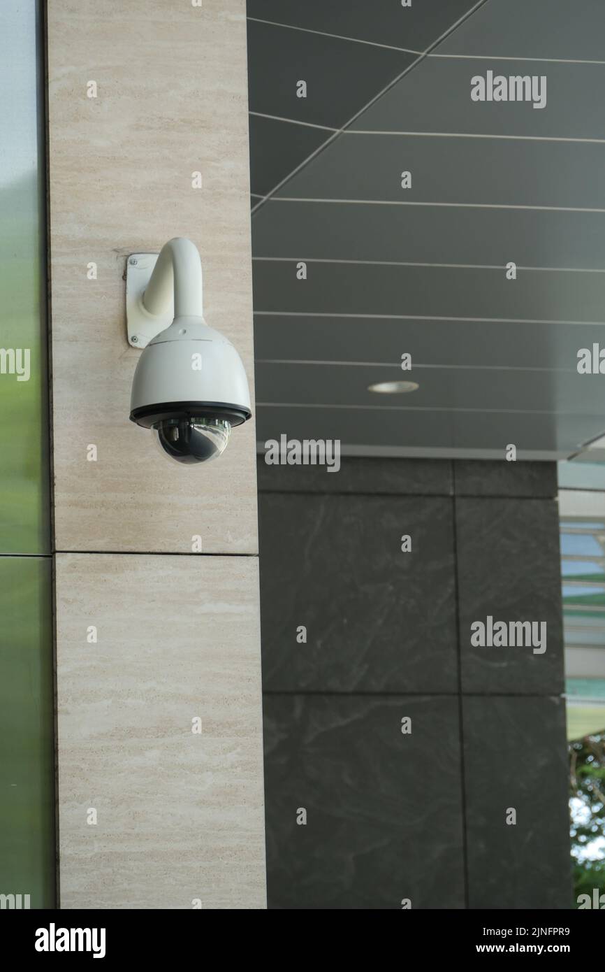 CCTV security camera operating outdoor  Stock Photo