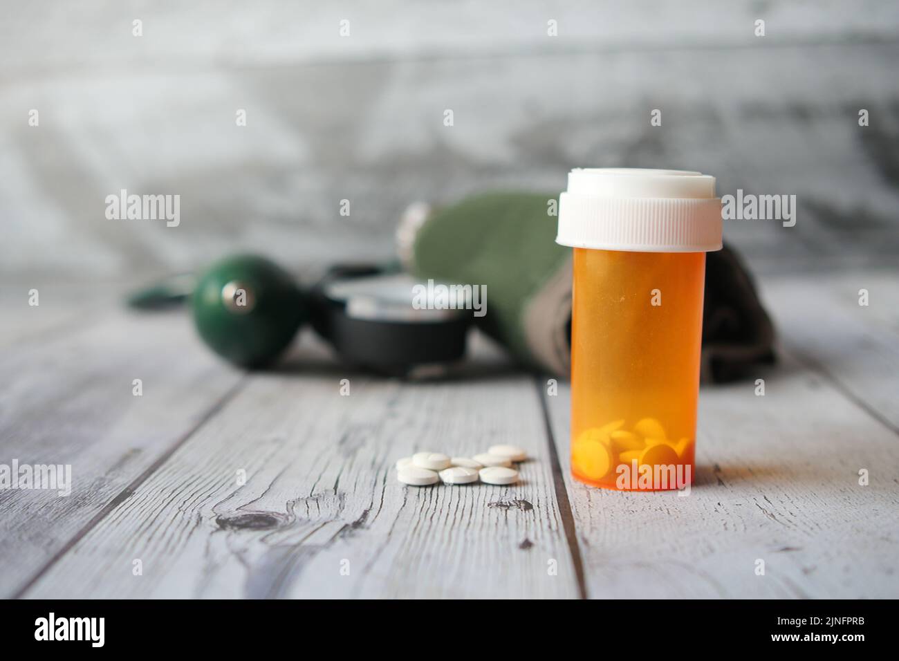 medical pills and blood pressure machine on table  Stock Photo